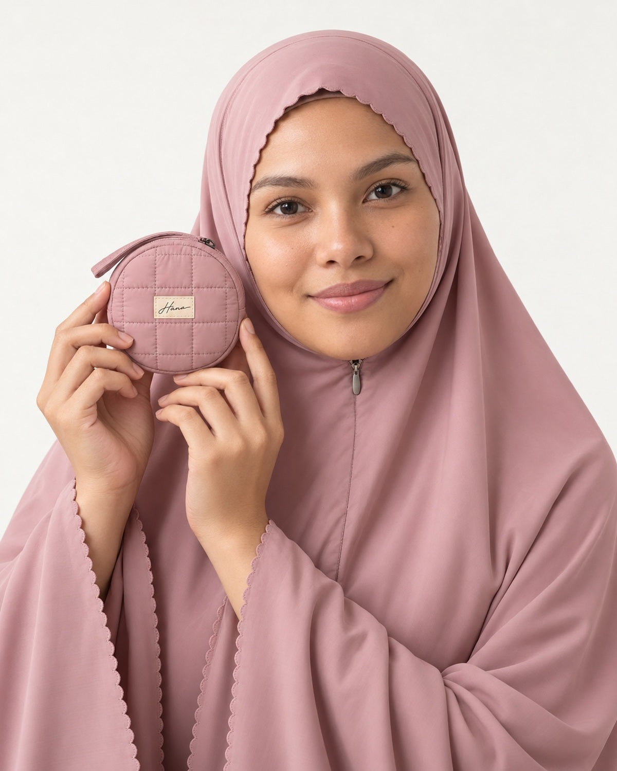 Pocket Prayer Outfit in Shafaq: the pouch is small enough to hold beside her face