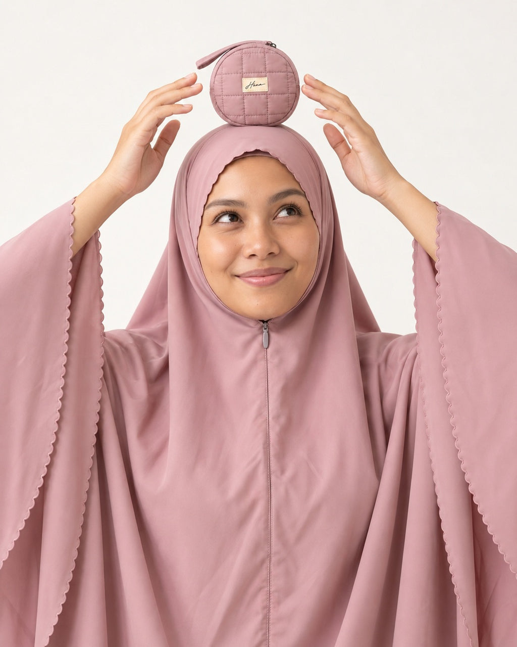 Pocket Prayer Outfit in Shafaq: so light and small she can balance the pouch on her head