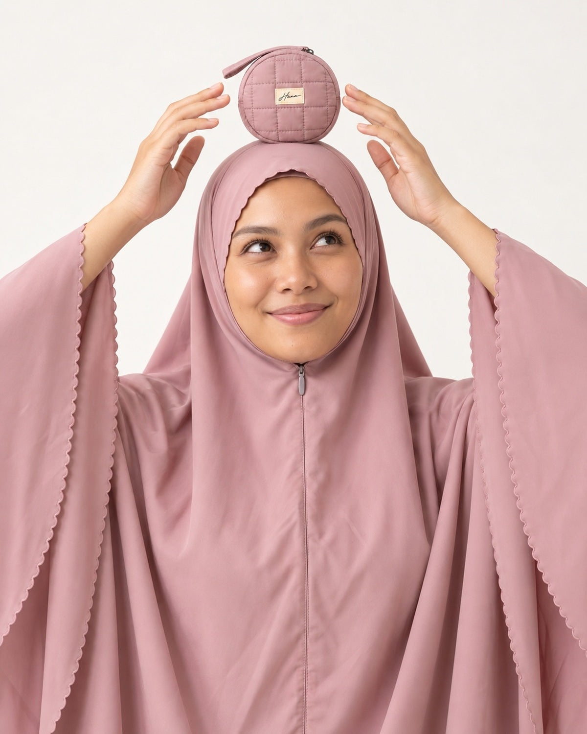 Pocket Prayer Outfit in Shafaq: so light and small she can balance the pouch on her head