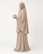 Pocket Prayer Outfit in Duha, beige, pouch resting on her palm