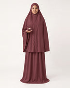 Pocket Prayer Outfit in Rumman, deep burgundy, pouch resting on her palm