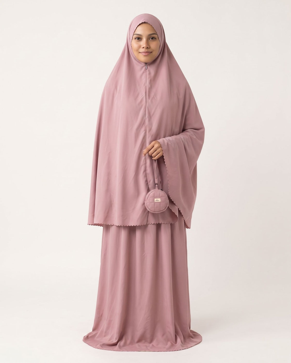 Pocket Prayer Outfit in Shafaq, sandy pink, worn with the matching pouch